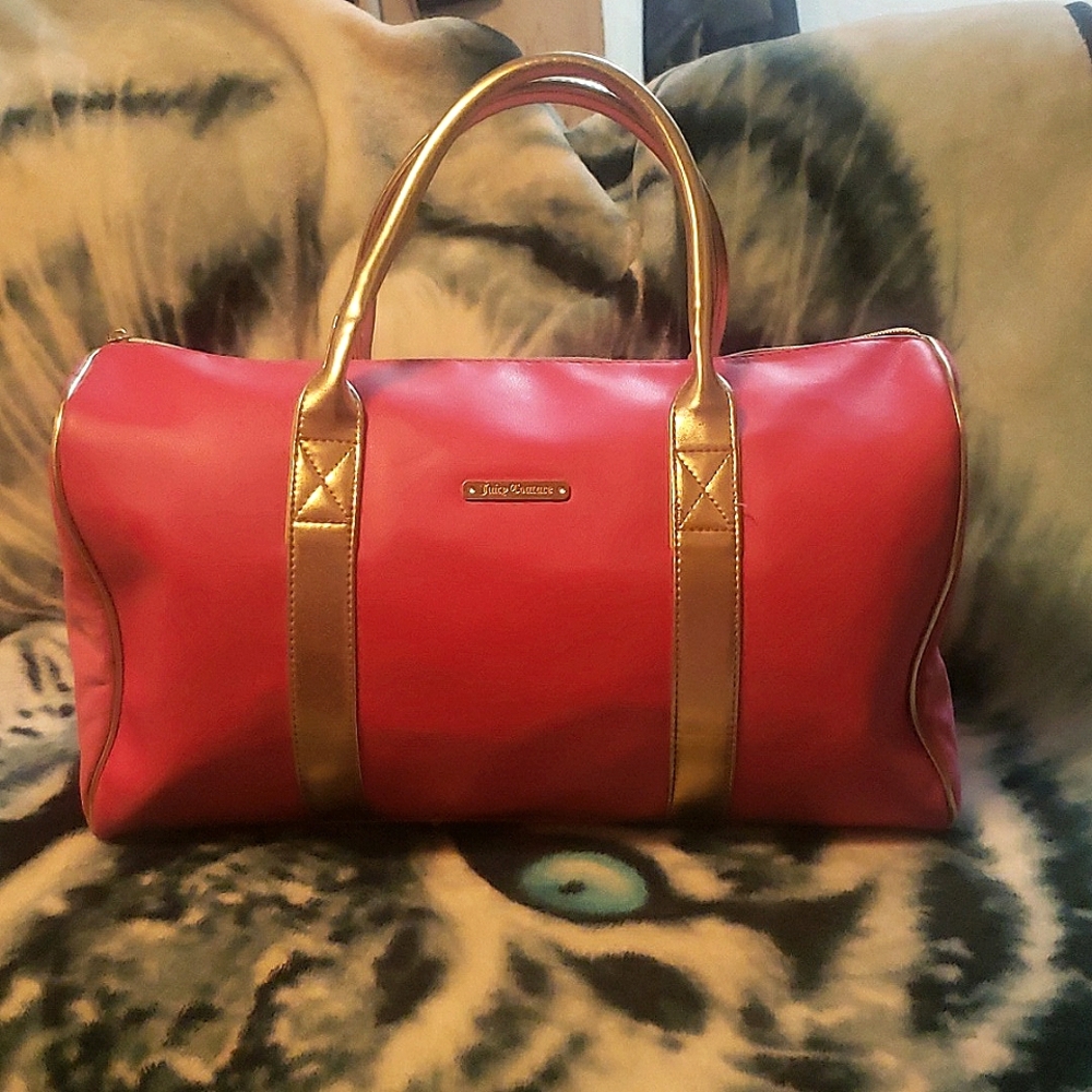 Juicy Small Duffel Bag. It is Pink and Gold Handles